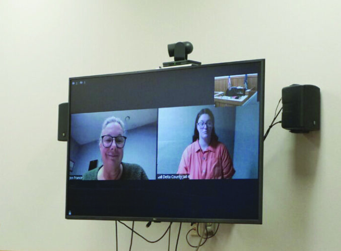 Escanaba woman to stand trial